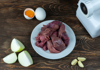 ingredients for cooking minced meat and meat grinder