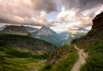 woman jumps on highline trail on cloudy day