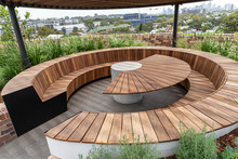 Outside Wooden Tables And Benches On A Rooftop