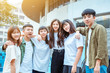 © Tom Wang - happy students group standing together at  campus