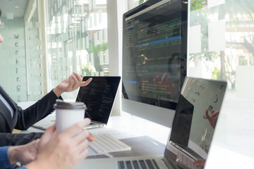 Wall Mural - programmers work on the development of coding and coding technology on white desks and website desig