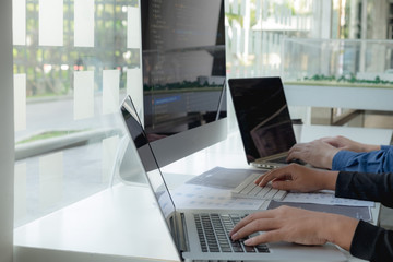 Wall Mural - programmers work on the development of coding and coding technology on white desks and website desig