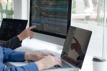 Wall Mural - programmers work on the development of coding and coding technology on white desks and website desig