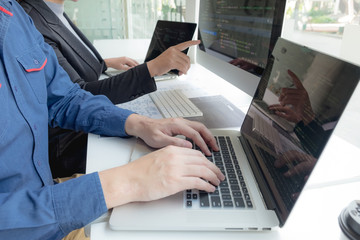 Wall Mural - programmers work on the development of coding and coding technology on white desks and website desig