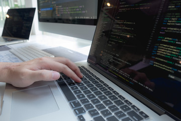 Wall Mural - programmers work on the development of coding and coding technology on white desks and website desig