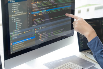 Wall Mural - programmers work on the development of coding and coding technology on white desks and website desig