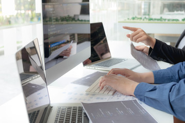 Wall Mural - programmers work on the development of coding and coding technology on white desks and website desig