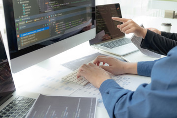 Wall Mural - programmers work on the development of coding and coding technology on white desks and website desig