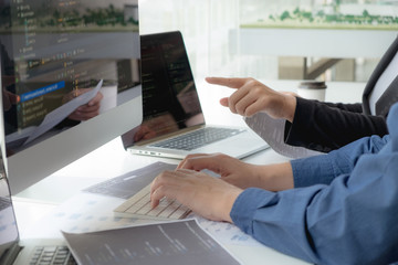 Wall Mural - programmers work on the development of coding and coding technology on white desks and website desig