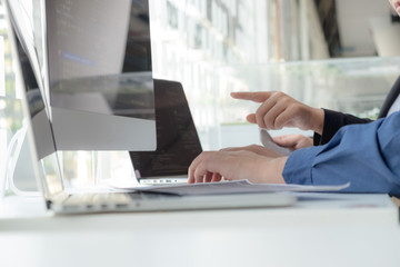 Wall Mural - programmers work on the development of coding and coding technology on white desks and website desig