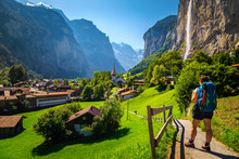 Woman Hiker With Backpack Enjoying The View In Lauterbrunnen, Switzerland