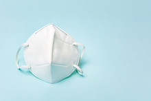 White Medical Face Mask. Concept Of Coronavirus Quarantine And Ultra-fine Microdust. Isolated Of White Background. Top View.