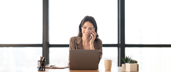 Wall Mural - Portrait of smiling manager making phone call