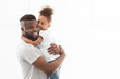© Prostock-studio - Beautiful afro family posing over white background