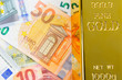 © andreyphoto63 - Euro cash and gold bar. Banknotes. Money. Bill. Ingot. Bullion.