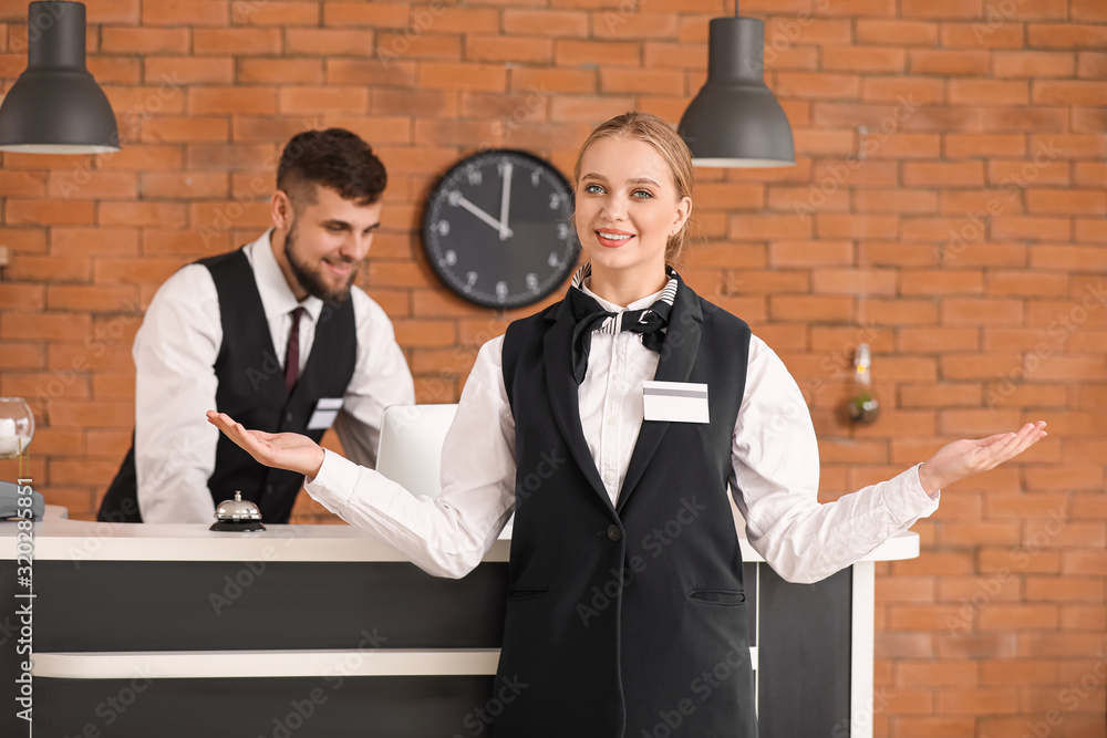Male and female receptionists in hotel