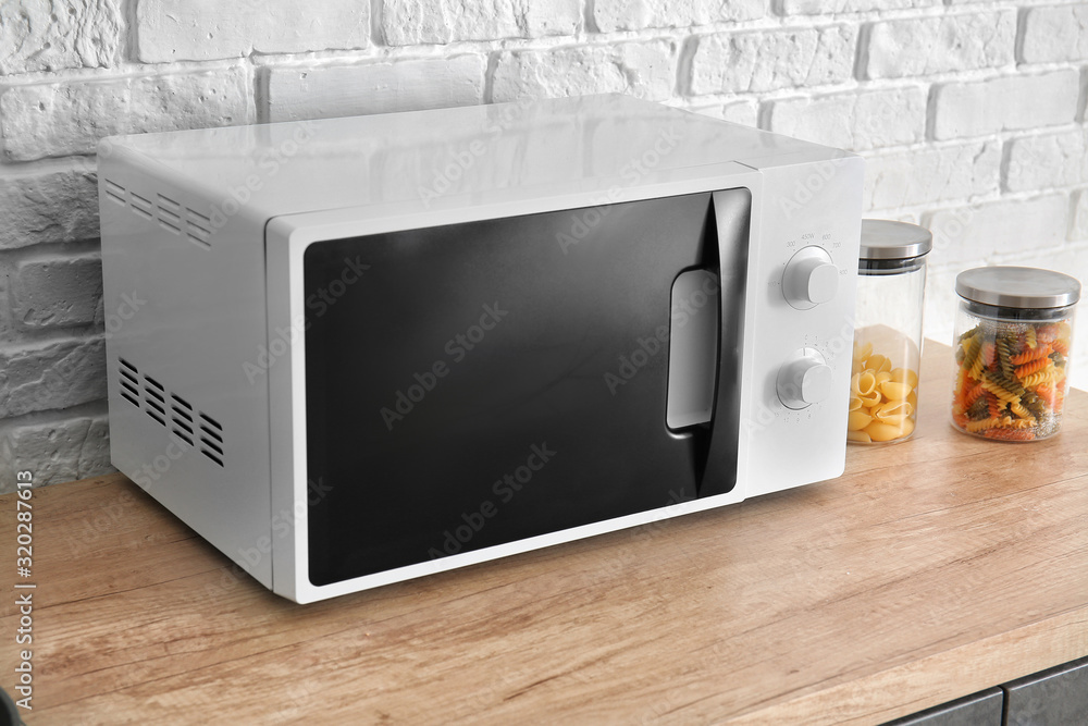Modern microwave oven in kitchen