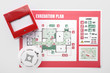 © Pixel-Shot - Evacuation plan, smoke detector and manual call point on white background