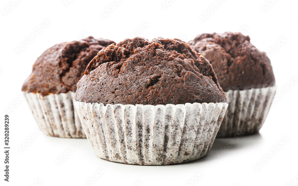 Tasty chocolate muffins on white background