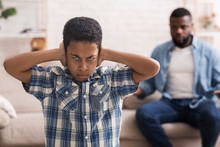 Preteen Black Boy Closing Ears Not To Listen Father's Scolding