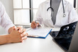 © Orathai - Female doctors, specialists in treatment, make an appointment to meet patients after x-ray and give advice, explain medical information and diagnose the disease. Concept of treatment and good health