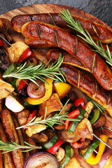 Wall Mural - Assorted delicious grilled meat with vegetable on a barbecue with Grilled pork shish or kebab on skewers with vegetables.