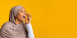 © Prostock-studio - Excited Afro Muslim Woman Making Announcement, Shouting At Copy Space