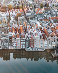 Wall Mural - The famous houses lining the edge of the Damrak canal basin, Amsterdam, Netherlands