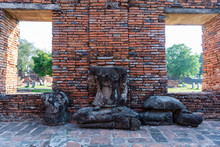 Old Sand Stone Buddha Image Statuie And Old Brick Wall Of Temple