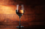 Fototapeta Lawenda - glass goblet with white wine