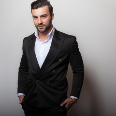 Handsome young elegant man studio portrait.