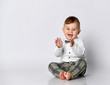 Happy baby. Little boy in a white shirt and bow tie. Children portrait. Stylish man in fashionable a bow-tie.