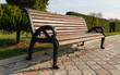 old park bench on paving slabs