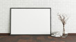 Blank horizontal poster frame mock up standing on dark parquet floor next to white brick wall with vase and books. Clipping path around poster. 3d illustration