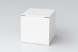 © dimamoroz - Blank white cube gift box with closed hinged flap lid on white background. Clipping path around box mock up. 3d illustration