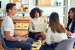 © Krakenimages.com - Group of business workers smiling happy and confident. Sitting on chairs relaxed with smile on face. Speaking taking rest at the office