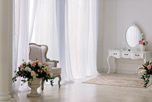 Bright Room With Rococo Furniture With A Vase Of Flowers And A Mirror. Interior Design.