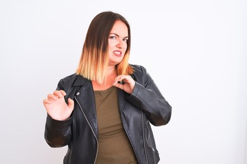 Wall Mural - Young beautiful woman wearing t-shirt and jacket standing over isolated white background disgusted expression, displeased and fearful doing disgust face because aversion reaction. With hands raised