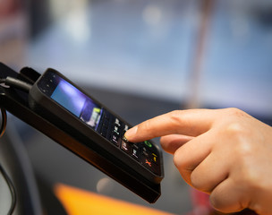 Wall Mural - person entering the password by shopping with a credit card