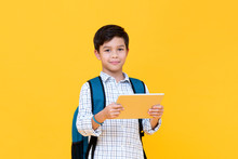 Handsome Young Boy In Backpack Holding A Tablet