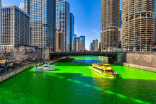 Chicago Building And Cityscape On Saint Patrick's Day Around Chicago River Walk With Green Color Dyeing River In Chicago Downtown, Illinois, USA, Crowned Irish And American People Are Celebrating.
