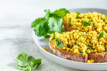 Wall Mural - Tofu scramble sandwich on a gray plate. Vegan food concept.