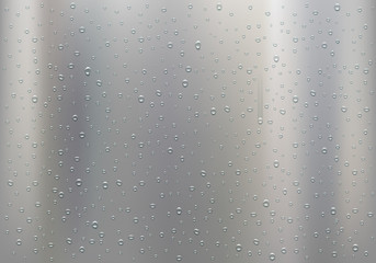 Drops of water on a polished metal plate.