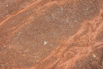 Wall Mural - Nature background of dry stream bed on lifeless desert land. Natural texture of wadi. Clay surface of barren dryland wasteland close-up. Full frame to terrain with arid climate. Dry small river bed.