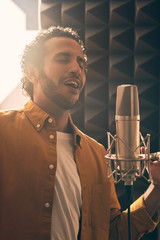 Wall Mural - Moroccan man recording vocals in studio