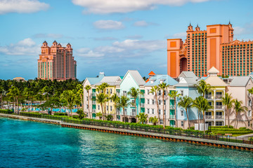 Fototapete - Colorful houses along the waterfront at the ferry terminal of Paradise Island, Nassau, Bahamas.