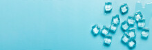 Ice Cubes With Water On A Blue Background. Ice Concept For Drinks. Banner. Flat Lay, Top View