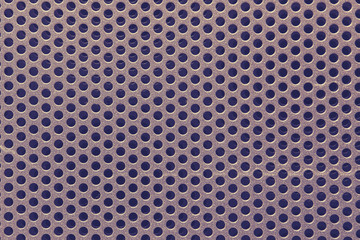 Background of a dark metal grid with round holes