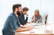 © yurolaitsalbert - businessman and a group of employees working in the office.