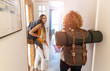 © pikselstock - Young women with backpacks arriving to a youth hostel